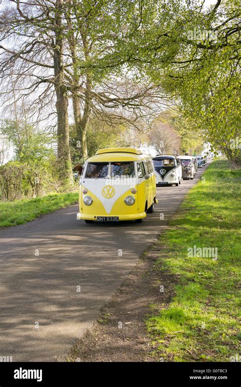 Volkswagen Split Screen Camper Vans In Convoy On A English Country Road