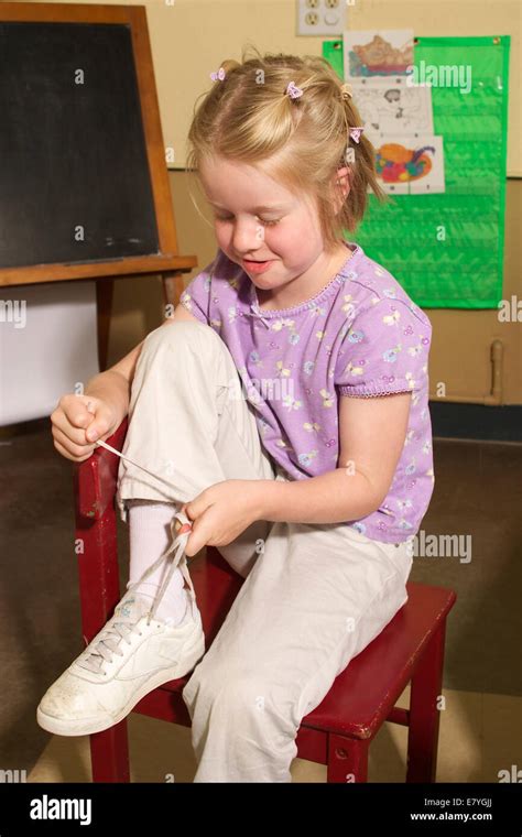 4 5 Year Years Old Olds Girl Learning To Tie Her Shoes In Classroom Ties Shoe Laces Shoelaces Mr