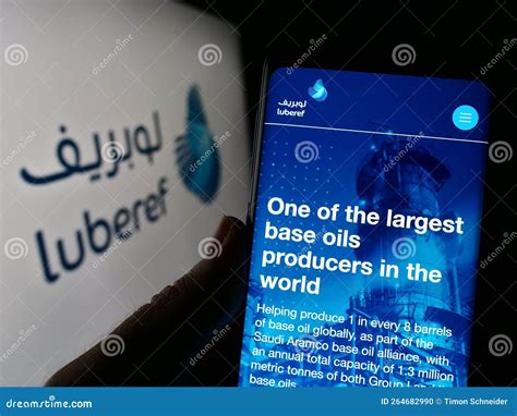 Person Holding Cellphone with Webpage of Saudi Arabian Base Oil Company Luberef on Screen in ...