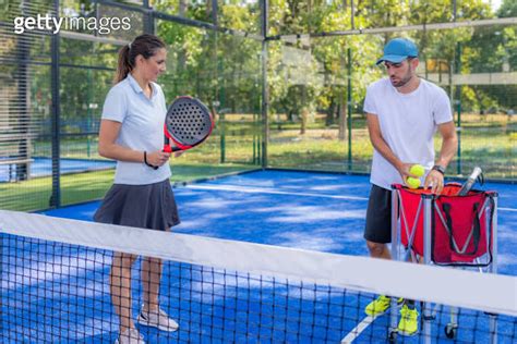 Skilled Padel Tennis Coach And Female Student At A Padel Personal