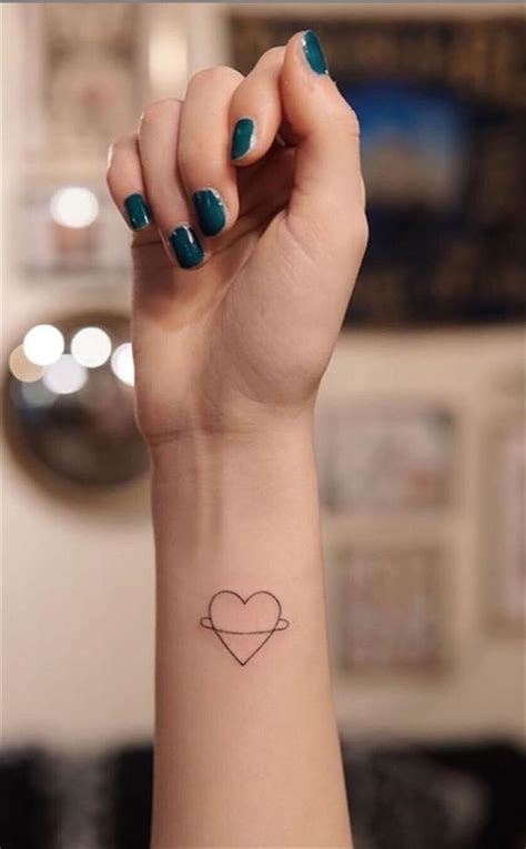 Simple Small Heart Tattoo Design For Woman On Valentine S Day To