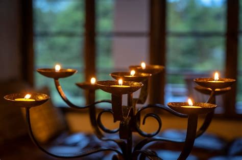 Premium Photo | The flaming candles on a candlestick. close up