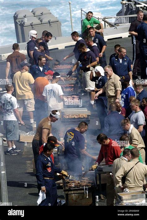 US Navy Crew members aboard the Nimitz-class aircraft carrier USS ...