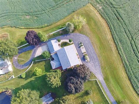 Premium Photo Aerial View Of Luxurious Suburban Home With Lush