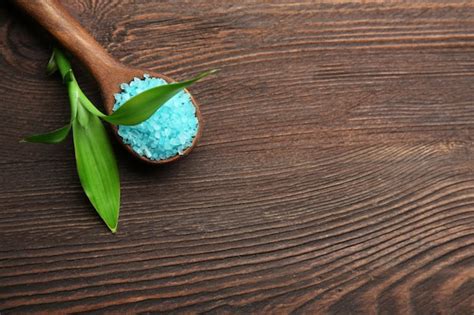 Premium Photo Spoon With Sea Salt On Wooden Background