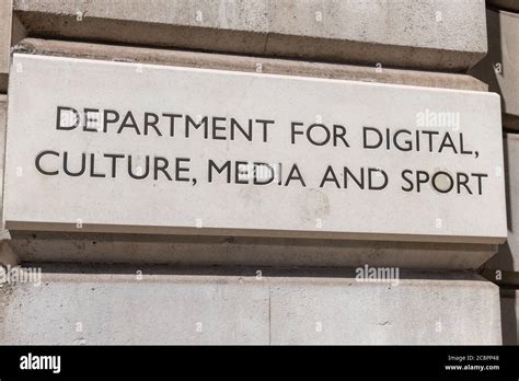 The Name Plate By The Entrance Of The Government Offices Of The