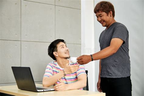 Gay Couple In Office Attractive Asian Men Drinking Coffee Together Stock Photo Image Of Email