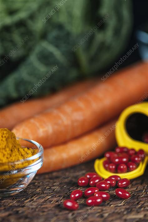 Beta Carotene Supplement Pills And Vegetables Stock Image F0270252