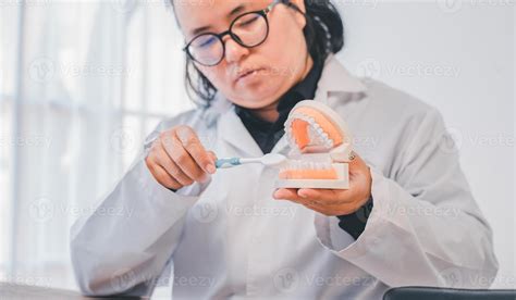 Dentists are demonstrating with dentures to educate them. About