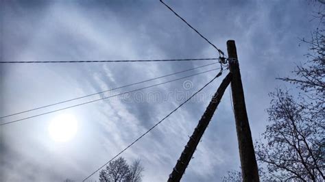 Power Electric Pole With Line Wire On Blue Background Close Up