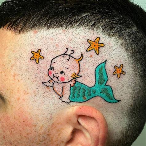 Mermaid Kewpie Tattoo Hand Poked On The Head