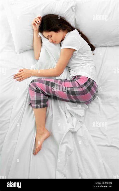 Beautiful woman in bed, top view Stock Photo - Alamy