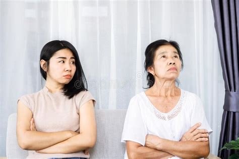 Old Senior Asian Mother Angry And Ignoring Her Young Daughter Daughter