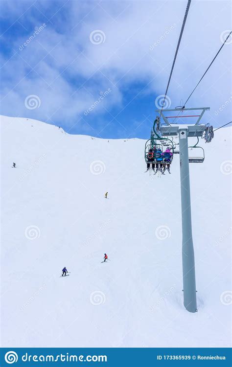 Skiers On Chairlift Up A Ski Slope In The Canadian Rockies Stock Image