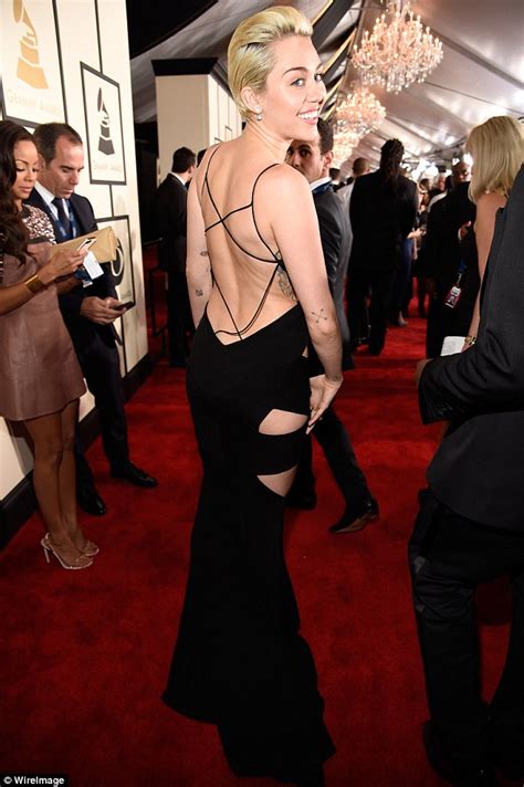 Miley Cyrus Stuns In Backless Black Cut Out Dress At Grammy Awards