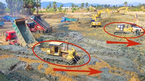 Fantastic Action Powerful Bulldozer Pushing Soil And Stone Into Water