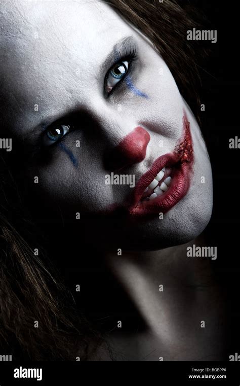 a scary and evil looking female clown Stock Photo - Alamy