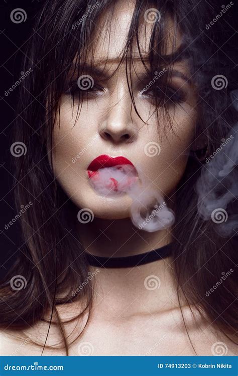 Beautiful Brunette Girl With Bright Makeup Red Lips Smoke From Mouth