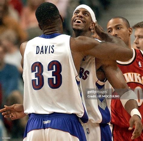 Toronto Raptors Forward Antonio Davis Embraces Team Mate Jerome