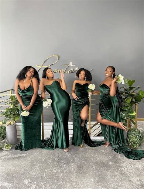 Four Women In Green Dresses Posing For The Camera