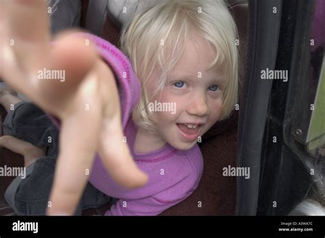 Blonde Girl Touching Camera Stock Photo Alamy