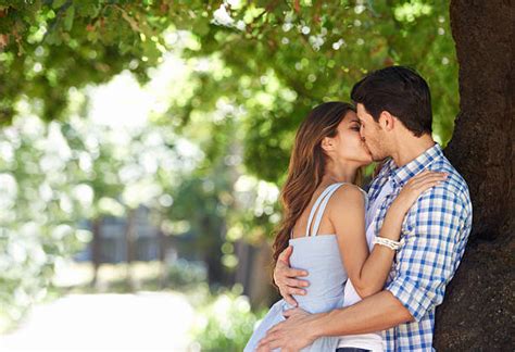 Leaning In For Kiss Stock Photos Pictures And Royalty Free Images Istock