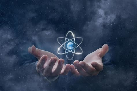 premium photo  person holding  atom   hands