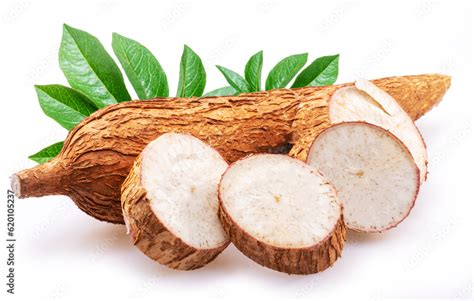 Cassava tubers with leaves and cassava slices isolated on white ...