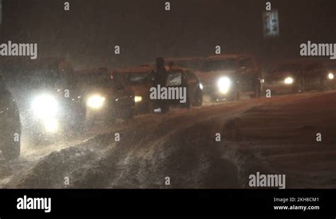 Traffic Jam With Cars Got Stuck In The Snow Storm In Winter Night Stock