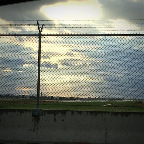 Premium Photo Barbed Wire Fence Against Cloudy Sky