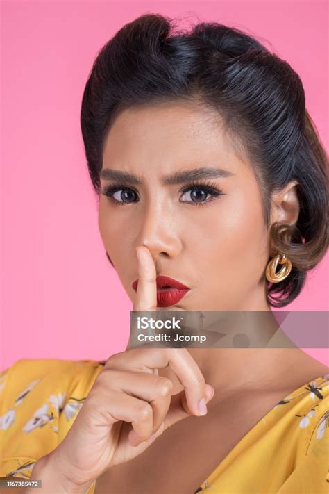 Beauty Asian Woman Red Lips And Finger Showing Hush Silence Sign Stock