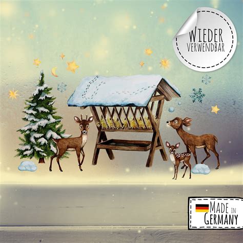 Fensterbild Fenstersticker Winterwald Futterkrippe Rehe Sterne