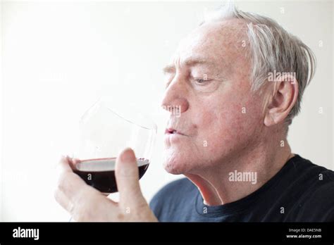 Senior Man Drinking Red Wine Stock Photo Alamy