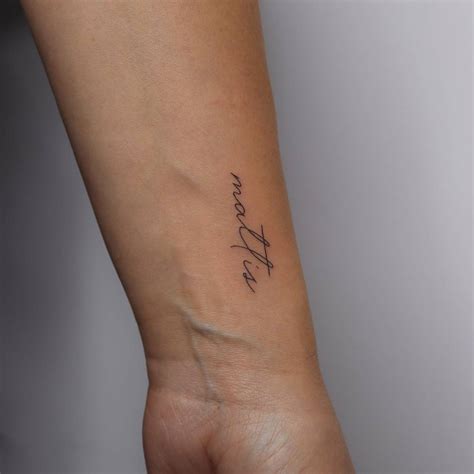 Handwritten Lettering Tattoo Located On The Wrist