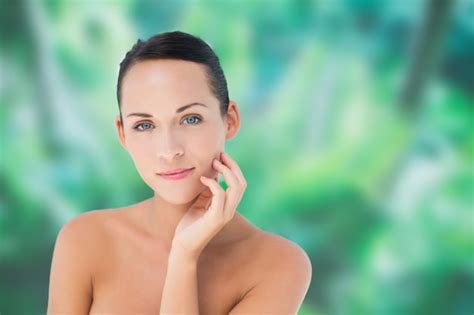 Premium Photo Beautiful Nude Brunette Posing With Hand On Face