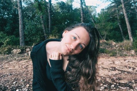 Premium Photo Portrait Of Beautiful Young Woman Standing Against