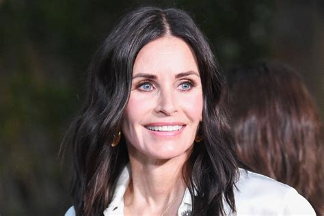 Download Smiling Courteney Cox Wallpaper | Wallpapers.com