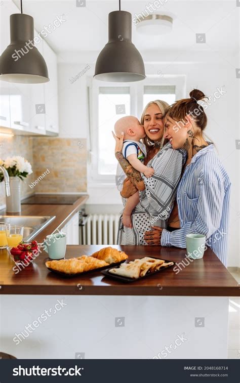 Same Sex Couple Cuddling Their Baby Stock Photo Shutterstock