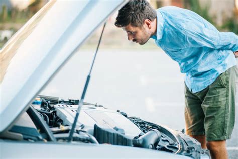 Looking Under Car Hood Stock Photos Pictures And Royalty Free Images