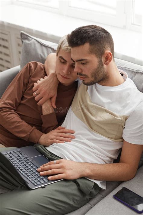 Gay Couple Relaxing At Home On Sofa Stock Image Image Of Couple Relaxation