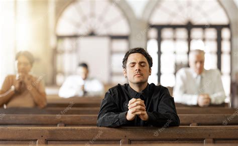 Premium Photo Prayer Religious And Young Man In Church With