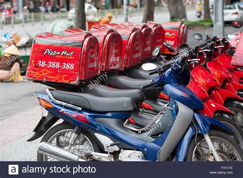 Pizza Hut delivery motorcycles in Saigon Stock Photo, Royalty Free ...