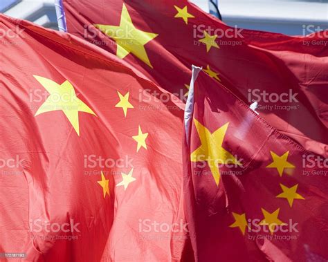 Three Chinese Flags In The Wind Stock Photo Download Image Now