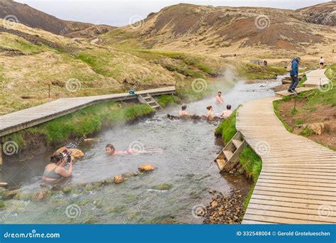 People Sitting At The Reykjadalur Valley Hot Spring Thermal River In Iceland Editorial Stock