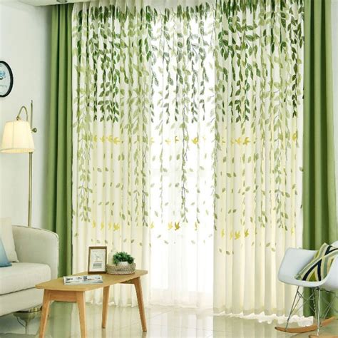 A Living Room With Green Curtains And White Furniture In Front Of A