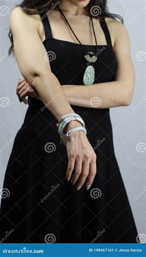 Woman With Oriental Jade Jewelry Bracelet And Pendant With Carved