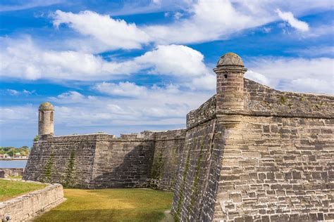 Download A Fortification With A Grassy Area And A Blue Sky