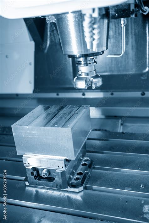 The vertical scene of CNC milling machine rough cutting the injection ... 