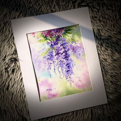 A Painting Of Purple Flowers Is Displayed In A White Frame On A Furry