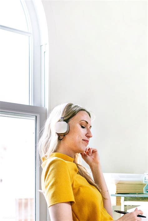 Casual woman in an office with headphones | premium image by rawpixel ...